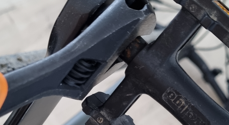 Bike pedal reinstalled using a wrench