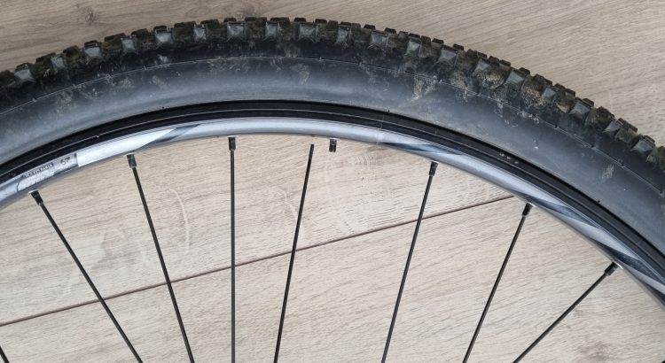 Bike wheel with a broken spoke